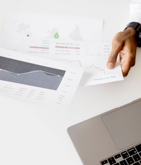 Business analysts reviewing process optimization charts in modern office