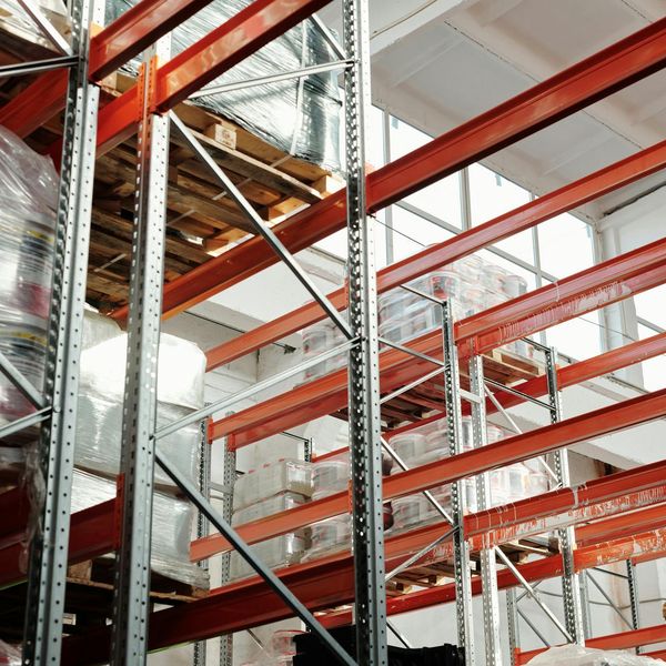 Large distribution center with warehouse management technology and robotic systems